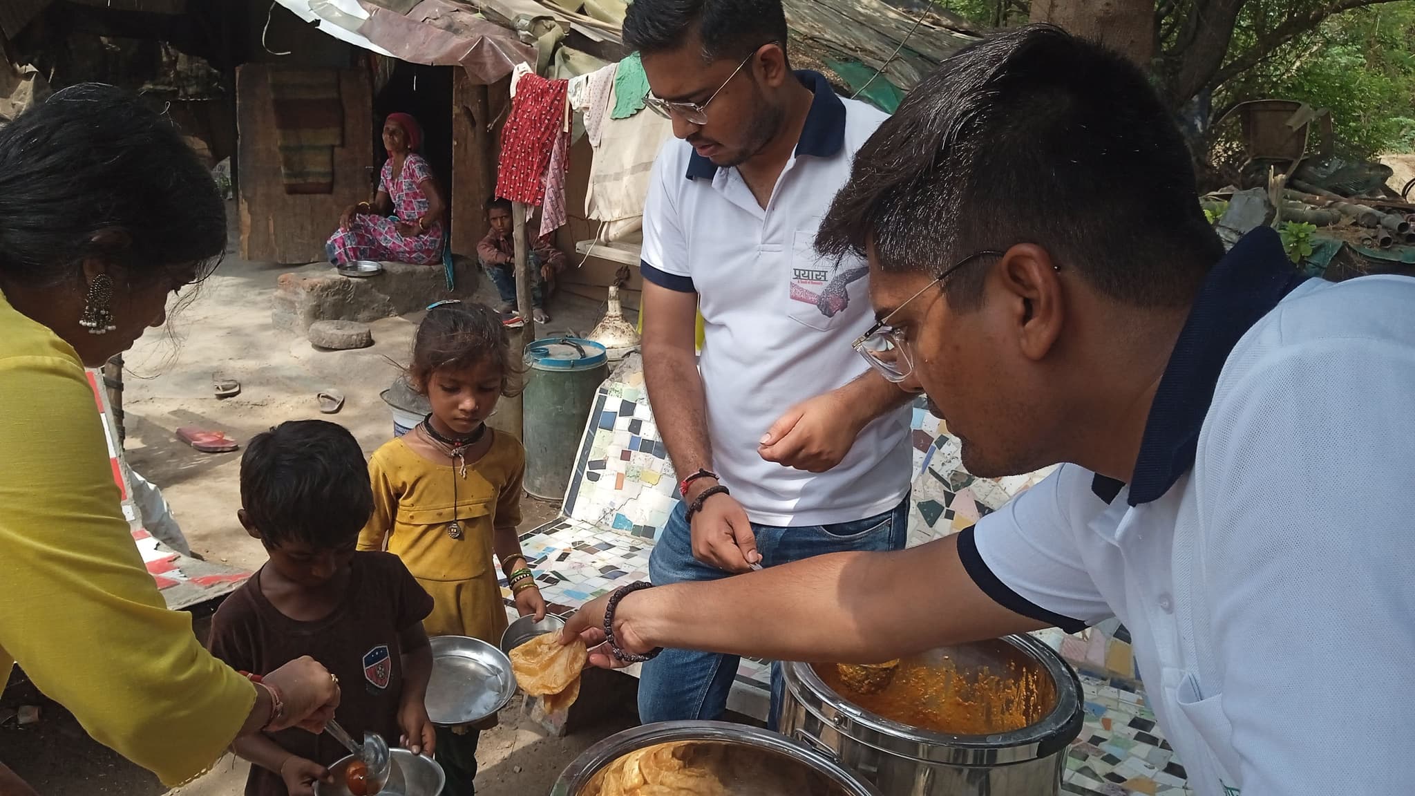 Prayas volunteers sharing food support with the community